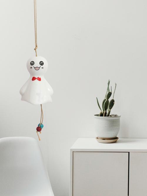 ceramic home decor and decorative hanging sunny doll with facial expression-3 wind chime bell in white colour - 15759624 - Very Small Image - 1
