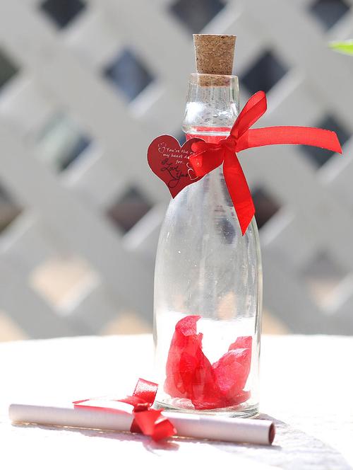 one unique bottle (bottle height 7 inches approx.),red ribbon,artificial rose petals,heart shape small tag - 15941897 - Very Small Image - 1