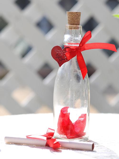 one unique bottle (bottle height 7 inches approx.),red ribbon,artificial rose petals,heart shape small tag - 15941898 - Very Small Image - 1