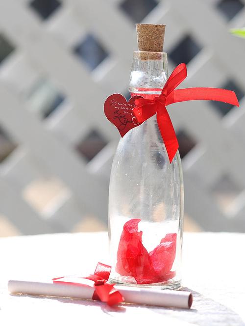 one unique bottle (bottle height 7 inches approx.),red ribbon,artificial rose petals,heart shape small tag - 15941900 - Very Small Image - 1