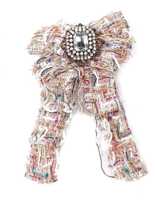 embellished with a stud metal brooch - 18297543 - Very Small Image - 1