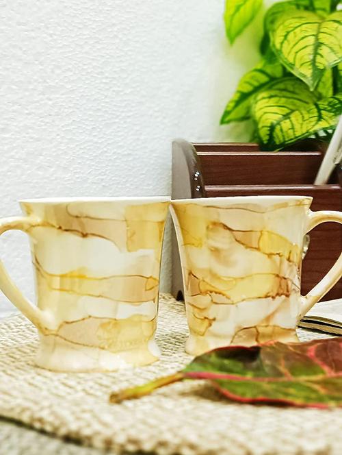caffeine ceramic handmade yellow & gold tea cup set (set of 4) - 19408756 - Very Small Image - 1