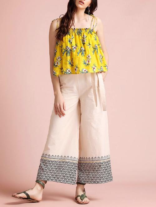 a bright set with printed yellow top and beige flared pants. - 13900888 - Very Small Image - 1