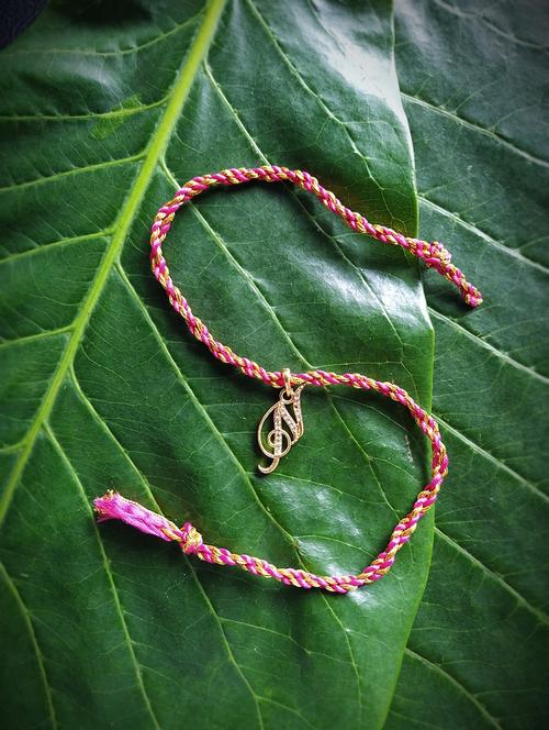 pink gold plated thread rakhi - 17892466 - Very Small Image - 1