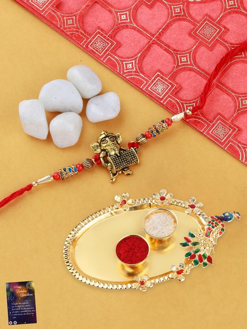 multi colored gold plated thread rakhi with roli chawal kankawati thali and greeting card  - 17900826 - Very Small Image - 1
