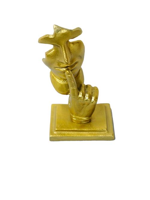 golden sculpture of a face with a finger to the lips - 21678491 - Very Small Image - 1