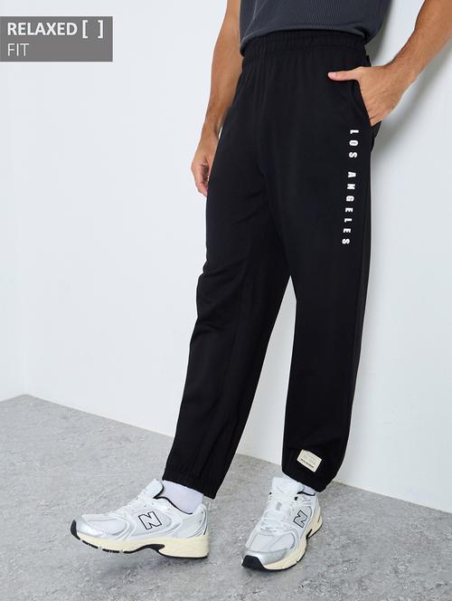 men typographic mid rise relaxed fit jogger - 22083315 - Very Small Image - 1