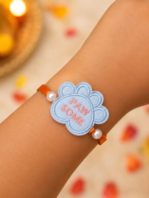 Handcrafted Thread Rakhi With Pearls - 22598231 - Very Small Image - 1